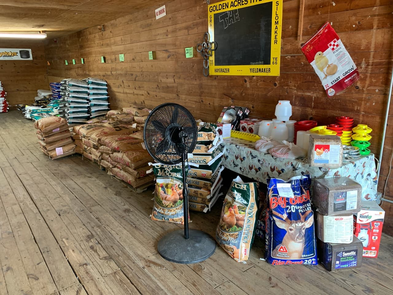 Scratch N' Moore complete layer mix and other feed brands stocked on the shelf at Mustang Creek Feed Seed & Supply